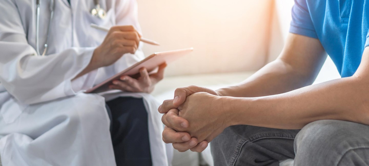 Stock photo of a doctor consulting with a patient.