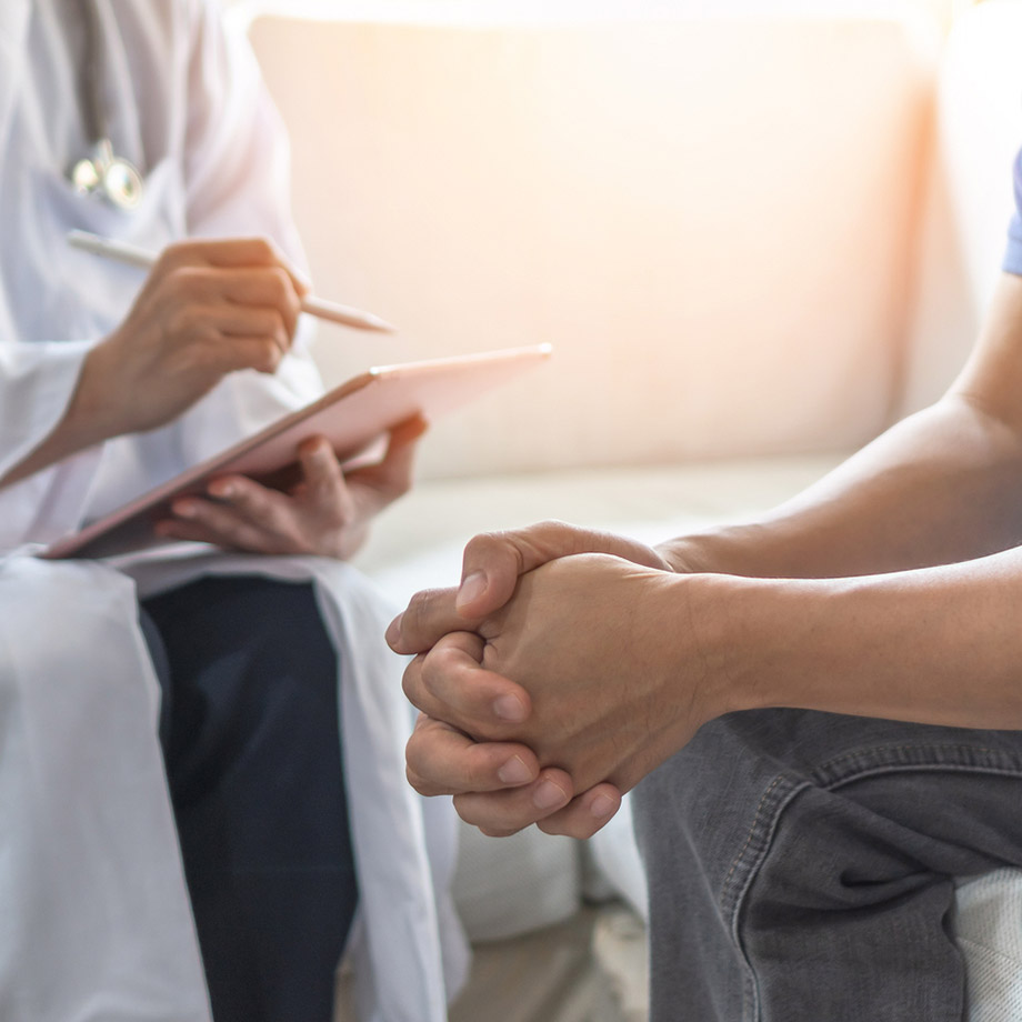 Stock photo of a doctor consulting with a patient.